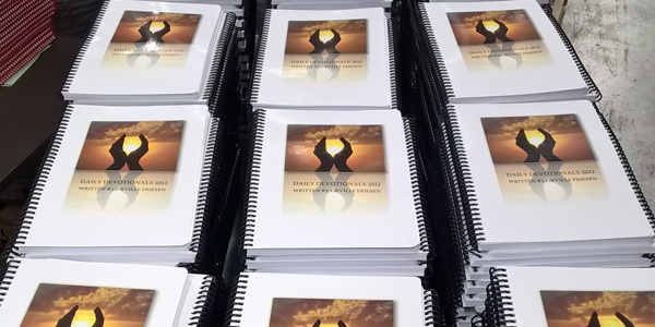 Stack of finished Booklets with Hole Punching & Binding